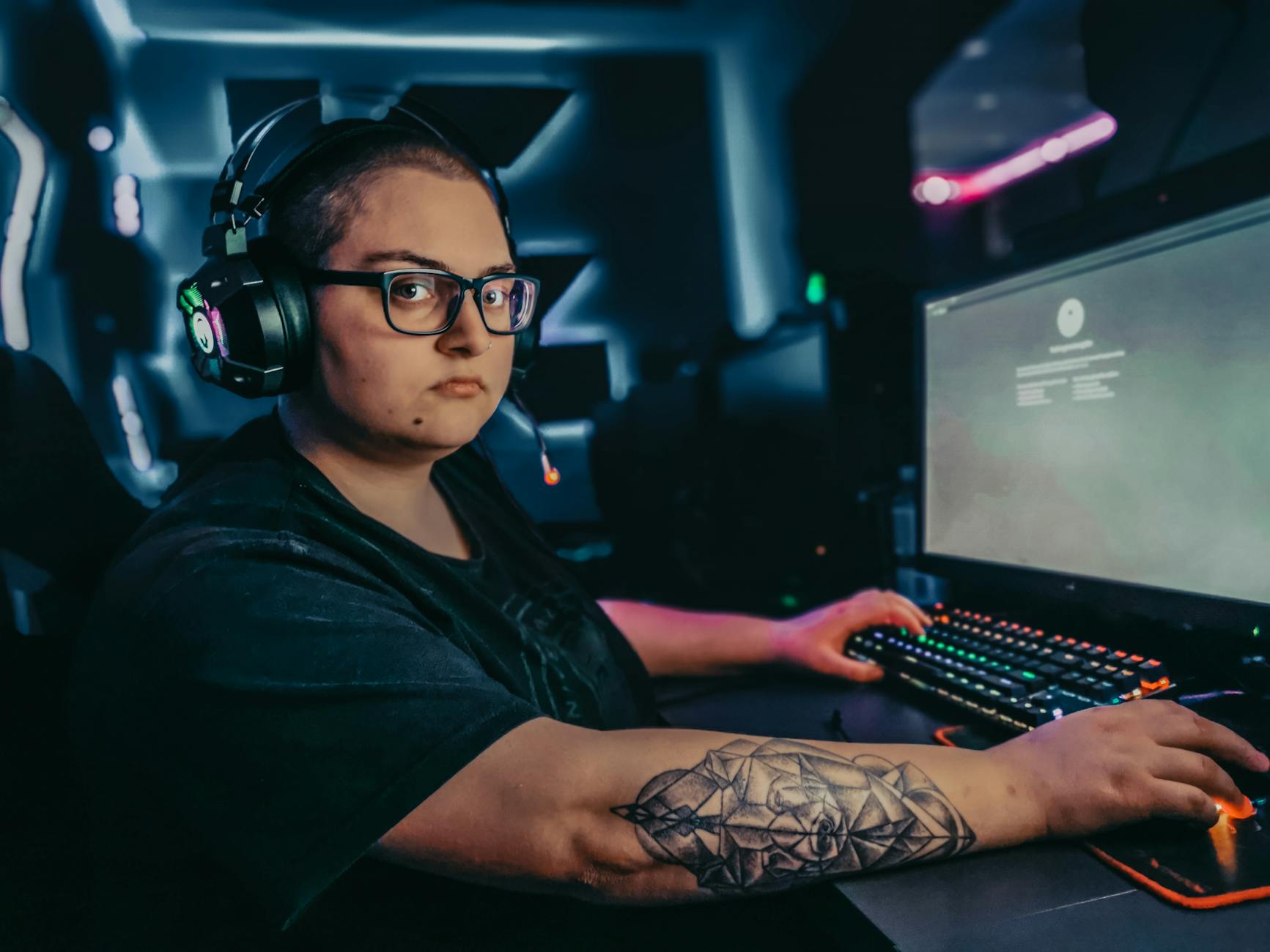 woman in black shirt using black headphones